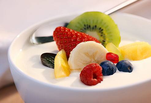 Simple Yogurt in white bowl with fruits on top