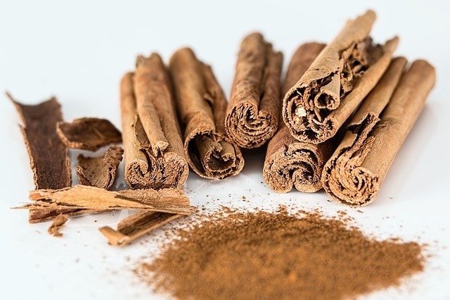 cinnamon stick and powder on the table