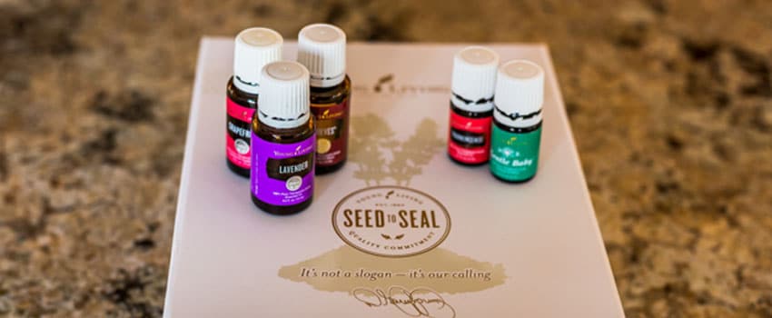 Five Young Living Essential oil blends placed on top of the company booklet