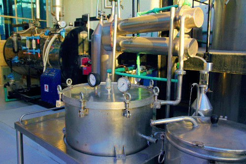 Machines used for distillation inside a room. Distillery