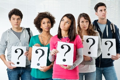 Group of people holding question mark card in blind window background