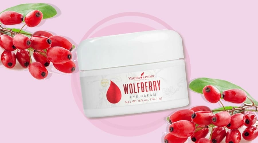 Wolfberry eye cream container with the wolfberry fruits on the bakcground