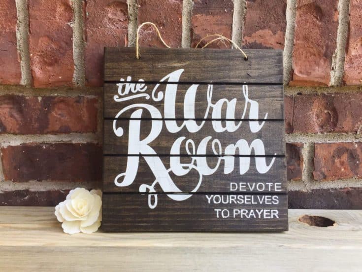 The beautiful dark brown wooden background comes in contrast with the handwritten-imitation lettering, creating a poetic icon for a sacred place.