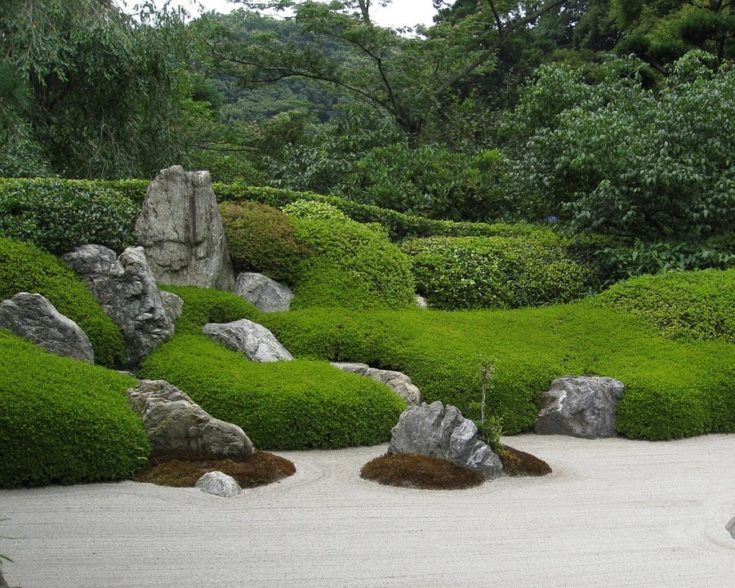 A large scale zen garden with rocks carefully placed.
