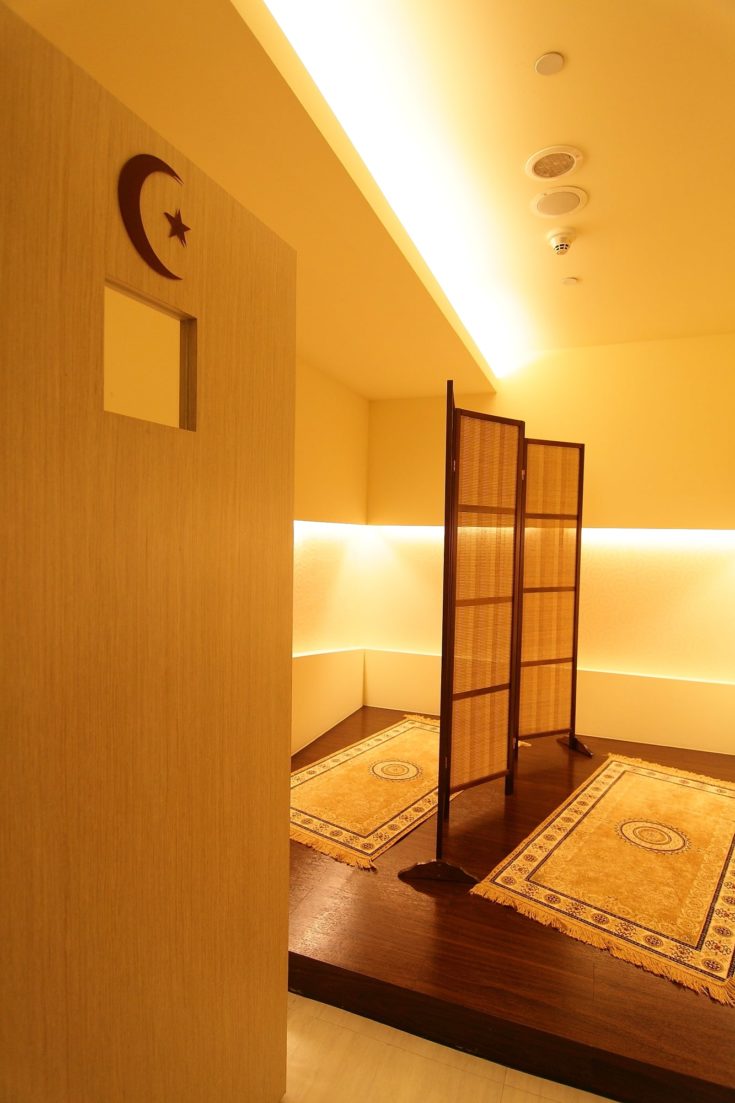 Islam (Muslim) prayer room with a screen partition and rugs