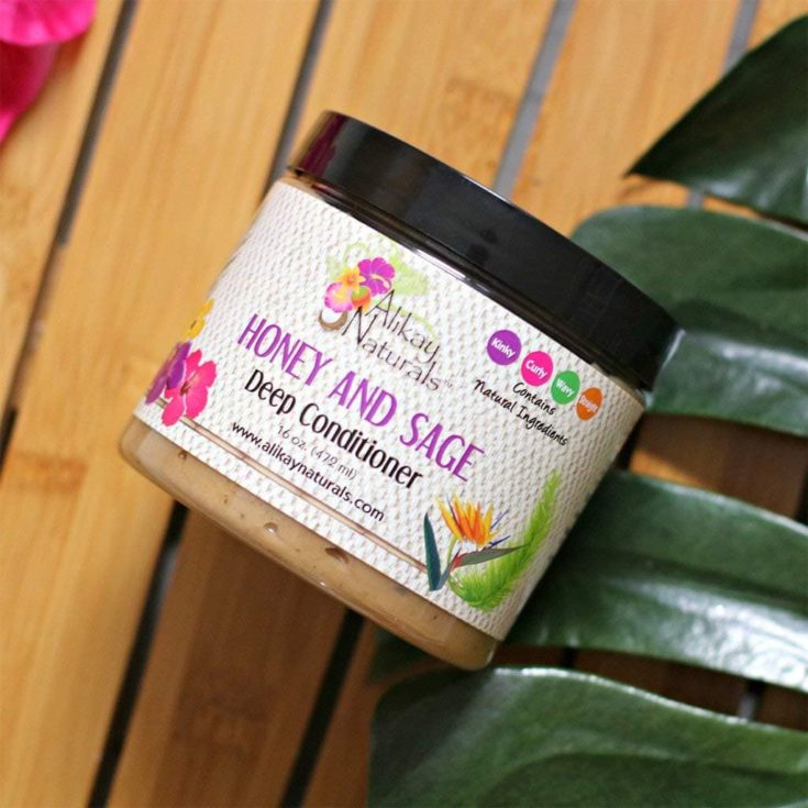 Alikay Naturals Honey and Sage Deep Conditioner placed in the wooden table with leaves