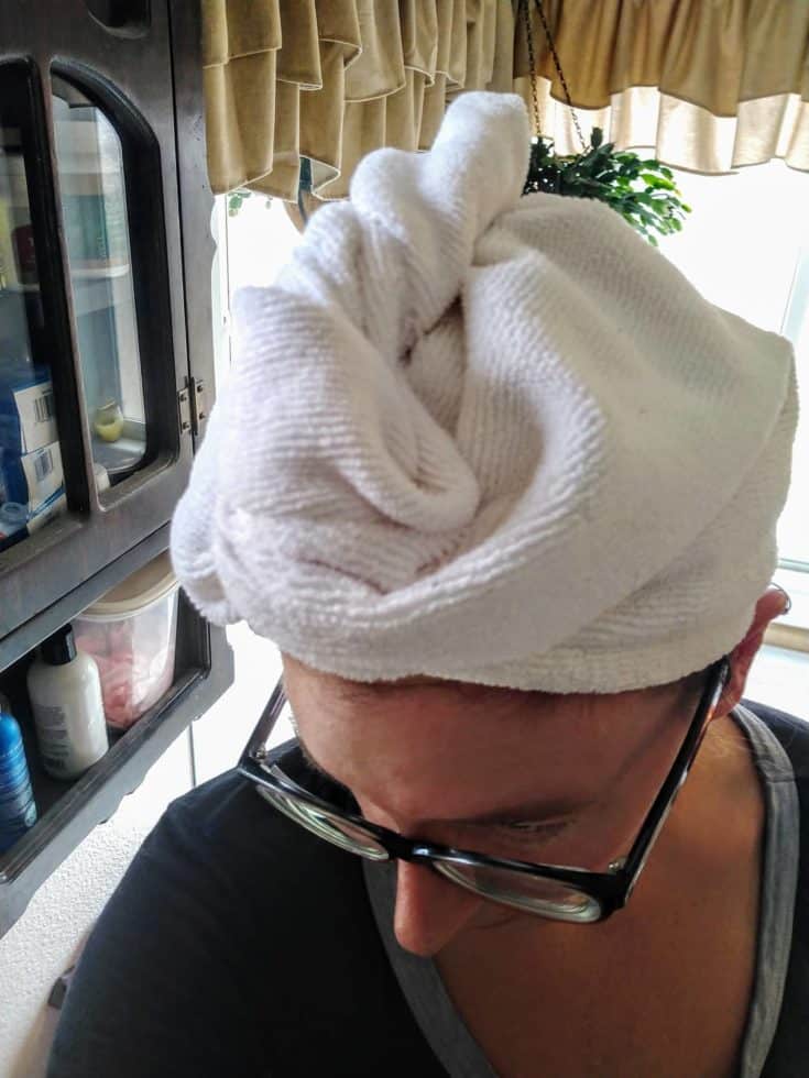 a woman that wrapped a towel in the head