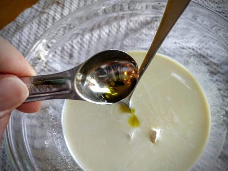 Adding a spoon of carrot seed oil into the mix