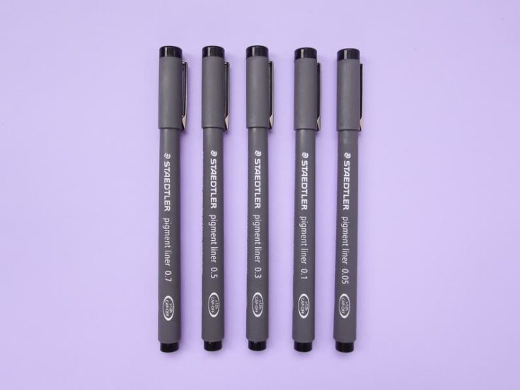 Staedtler Pigment Fine Liner Pen Set in a purple background.